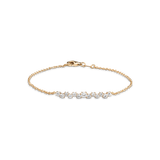 Diamantarmband aus 14K Echtgold und runden Lab Grown Diamanten in asymmetrischer Anordnung und verschiedenen Größen.